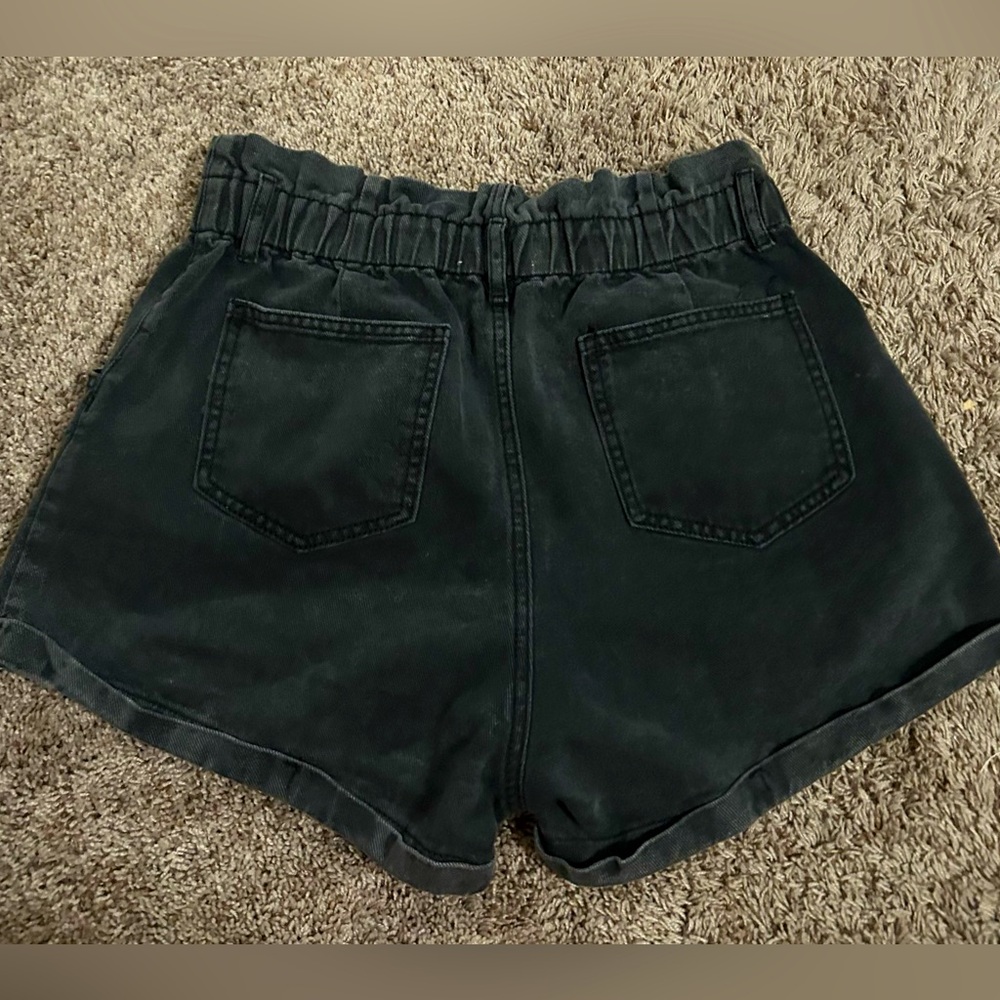 Day + Moon size large black denim shorts.